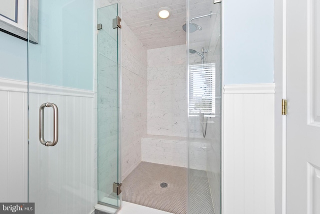 bathroom with a shower with shower door