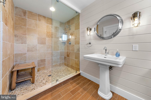 bathroom with tiled shower