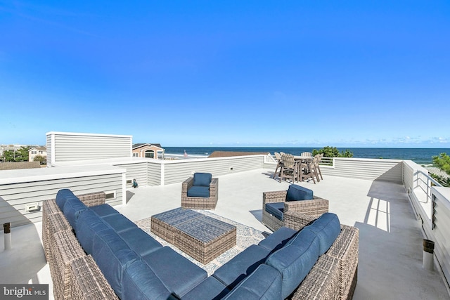 view of patio / terrace with an outdoor hangout area and a water view