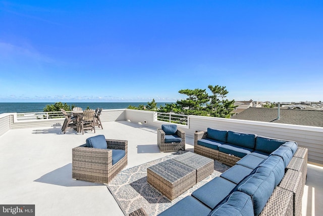 view of patio featuring a water view and an outdoor hangout area