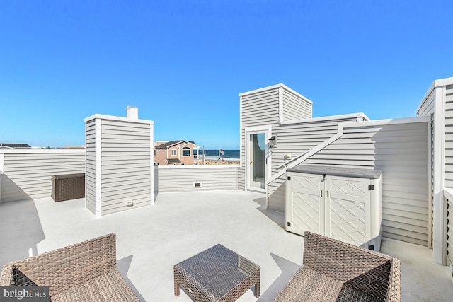 view of patio / terrace with a water view