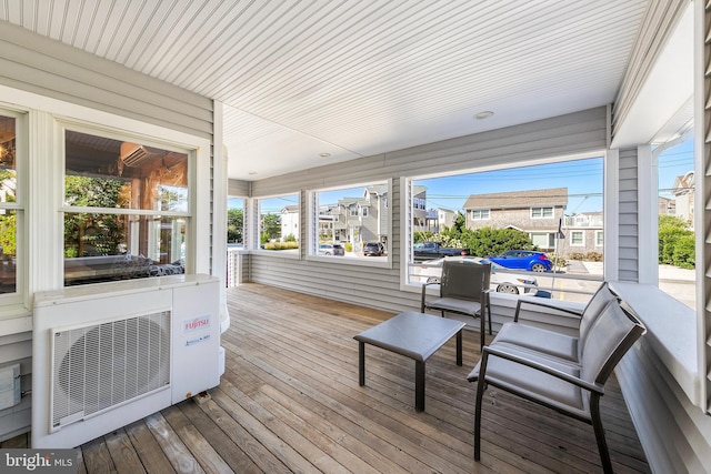 sunroom / solarium featuring ac unit