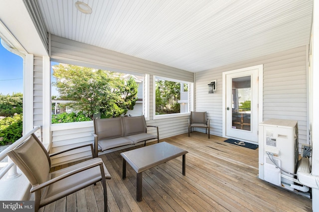 wooden terrace featuring outdoor lounge area