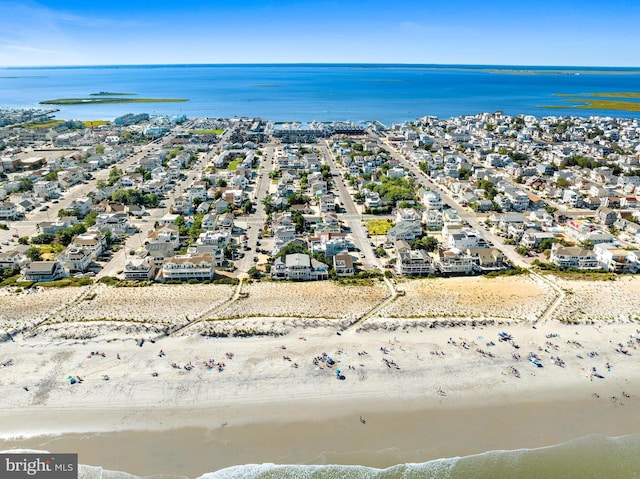 birds eye view of property featuring a water view and a view of the beach