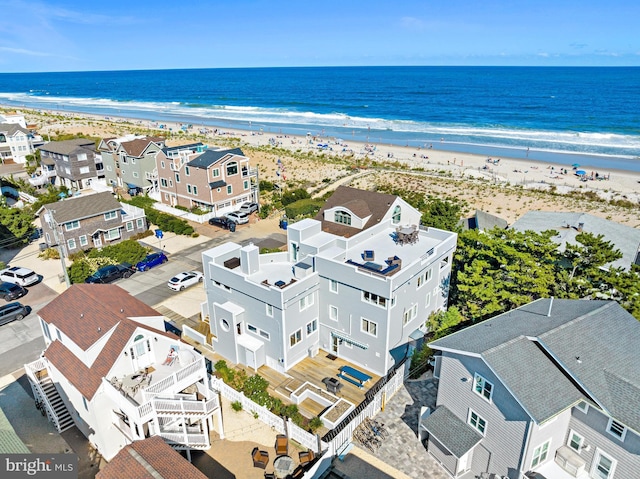 aerial view with a beach view and a water view