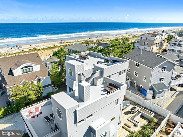 bird's eye view with a water view and a view of the beach