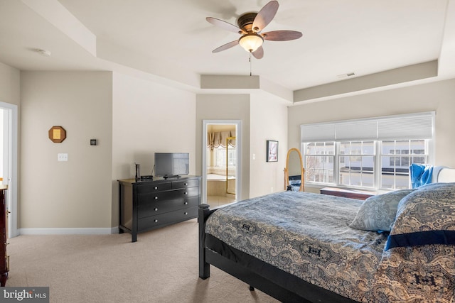 carpeted bedroom with connected bathroom and ceiling fan