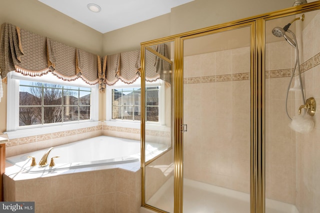 bathroom with shower with separate bathtub