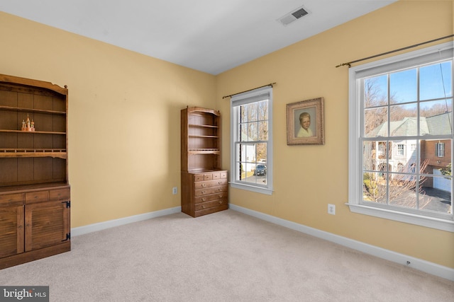 interior space featuring light colored carpet