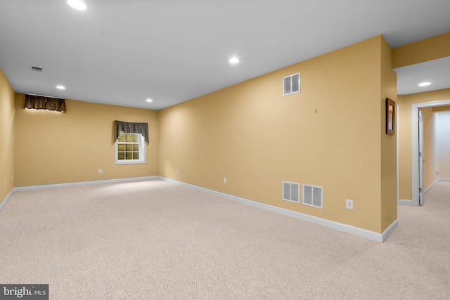 empty room featuring light colored carpet