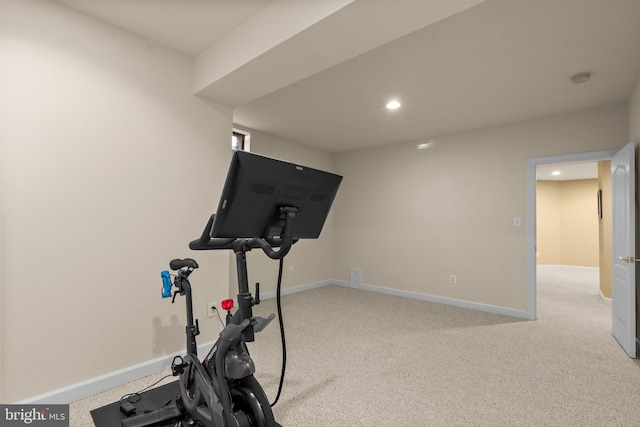 workout room with light colored carpet