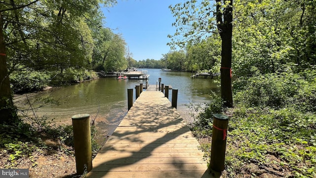 view of dock with a water view