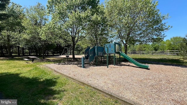 view of playground with a yard