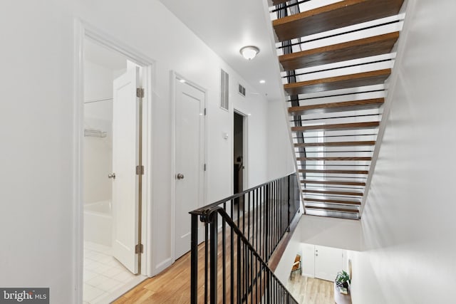 hall with light hardwood / wood-style flooring