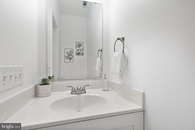 bathroom featuring vanity and mail boxes