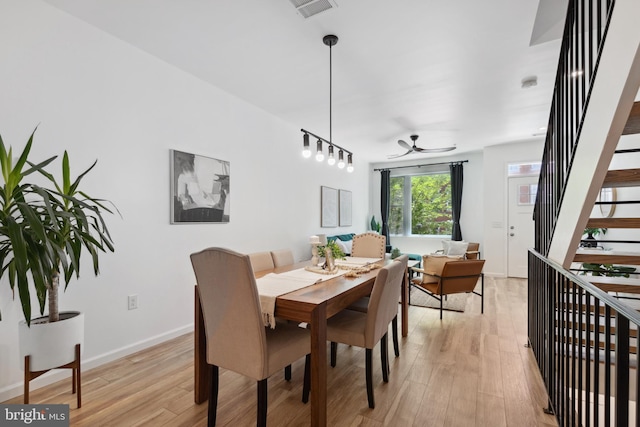 dining room featuring light hardwood / wood-style floors and ceiling fan