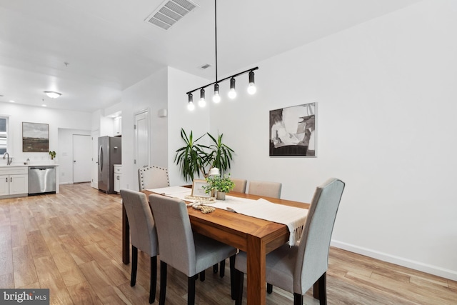 dining area featuring light hardwood / wood-style floors