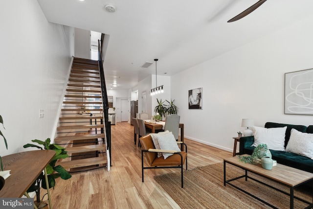 living room with light hardwood / wood-style floors