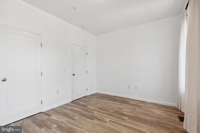 unfurnished bedroom with light hardwood / wood-style flooring