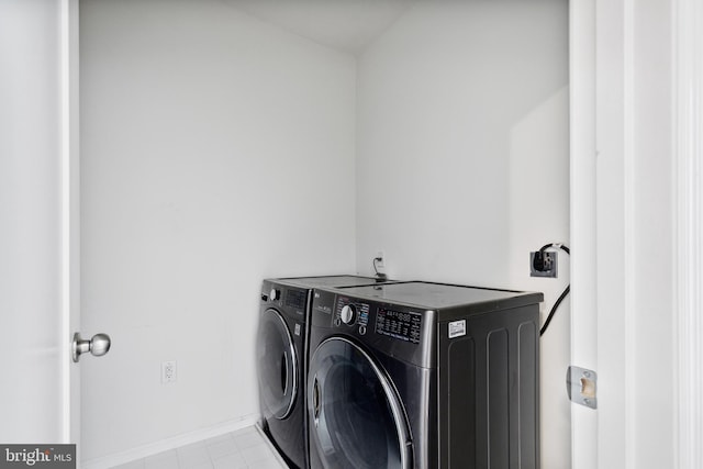 washroom with washer and clothes dryer