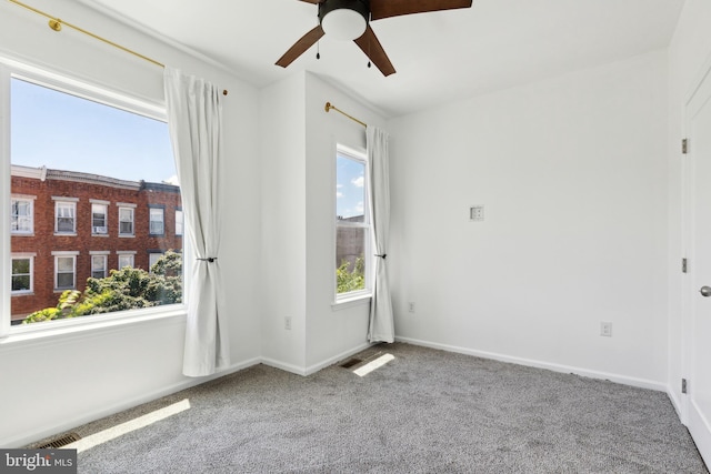 carpeted empty room with ceiling fan