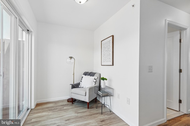 sitting room with light hardwood / wood-style floors