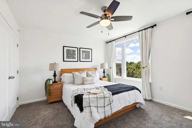 bedroom with ceiling fan and dark carpet