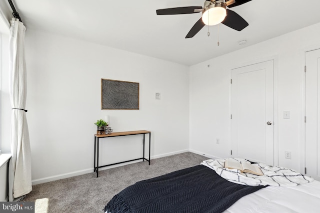 bedroom with ceiling fan and light carpet