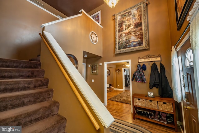 stairs featuring hardwood / wood-style floors