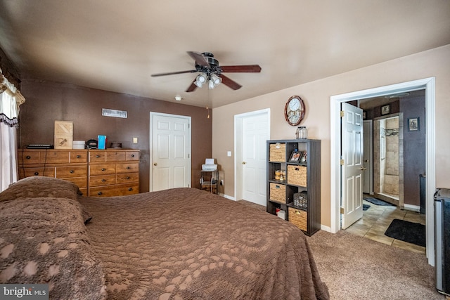 bedroom with ceiling fan and light carpet