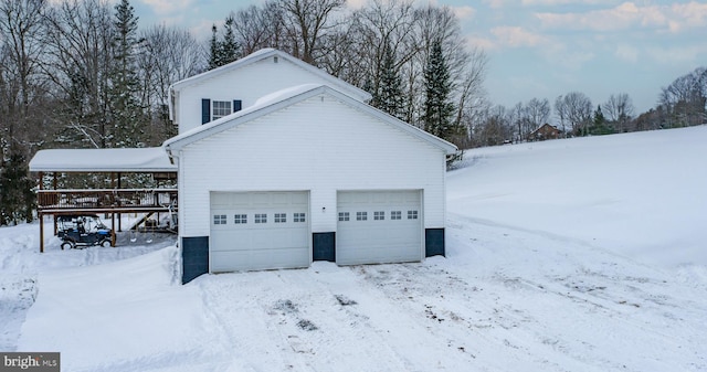 view of snow covered garage