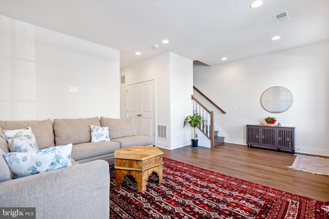 living room featuring dark wood-type flooring