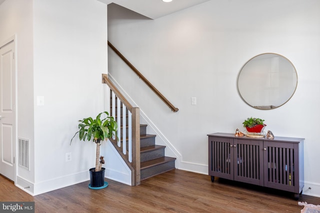 staircase featuring hardwood / wood-style floors