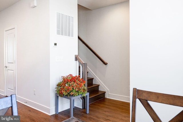 stairs with hardwood / wood-style flooring