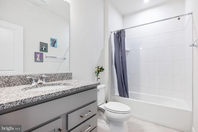 full bathroom featuring vanity, toilet, shower / tub combo, and tile patterned flooring