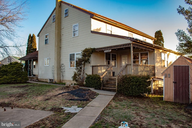 exterior space featuring a storage shed and a porch