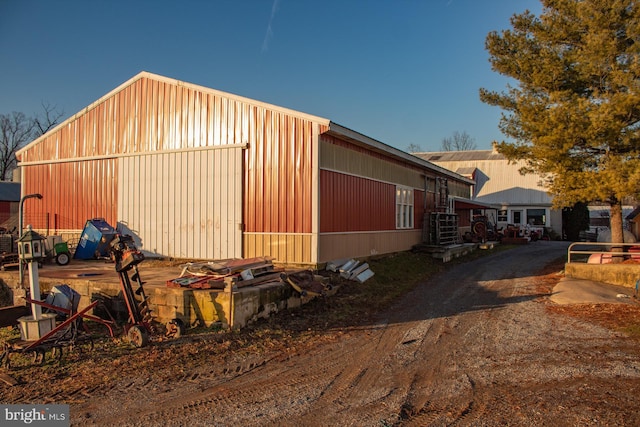 view of property exterior featuring an outdoor structure