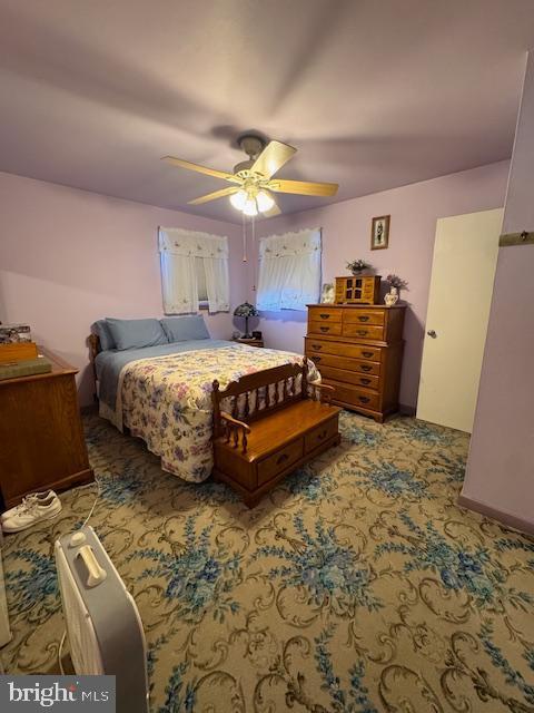 bedroom featuring carpet floors and ceiling fan