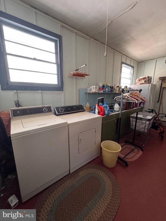 laundry room featuring washing machine and clothes dryer