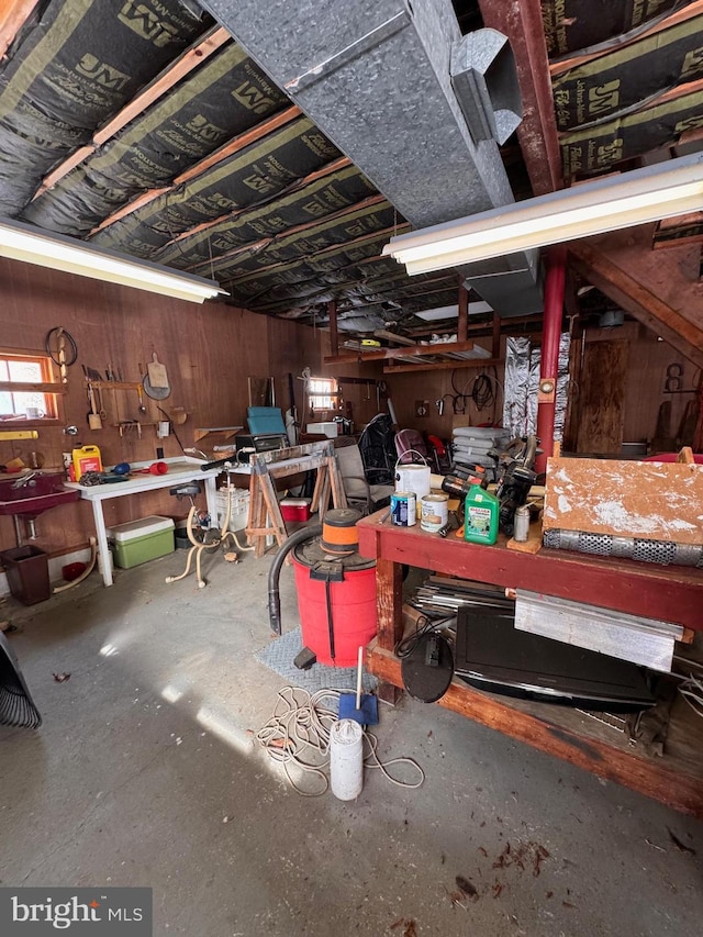 interior space with a workshop area and concrete floors