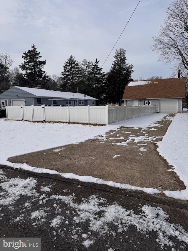 view of yard layered in snow