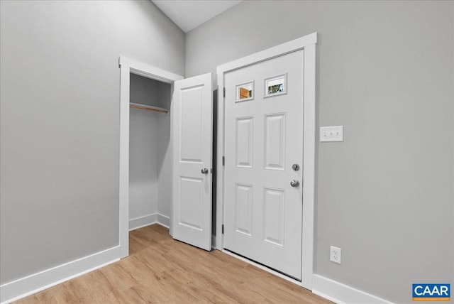 foyer entrance with light hardwood / wood-style floors