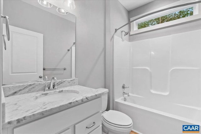 full bathroom with toilet, vanity, and tub / shower combination