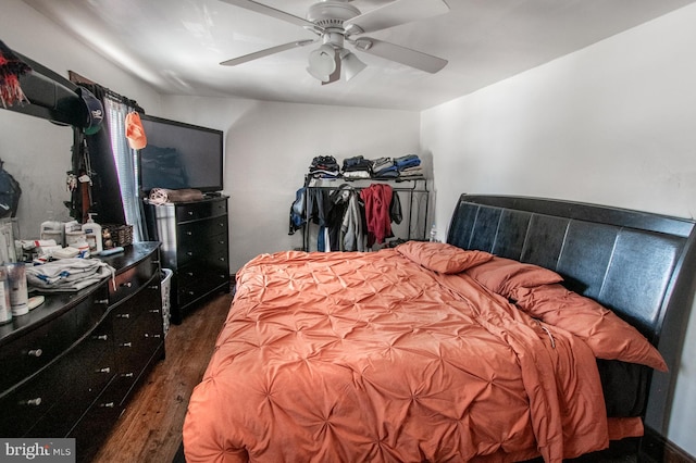 bedroom featuring dark wood-type flooring and ceiling fan