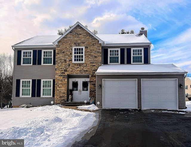 view of front of property with a garage