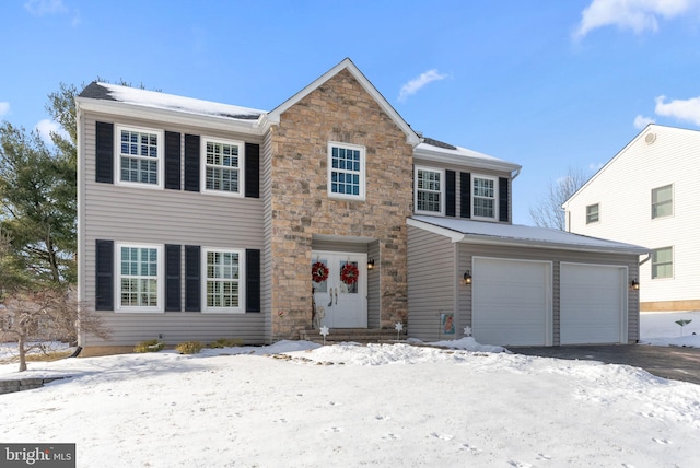 colonial home with a garage