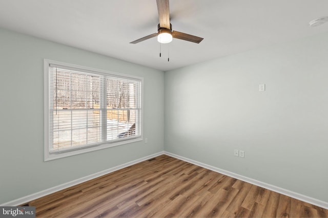 unfurnished room with wood-type flooring and ceiling fan