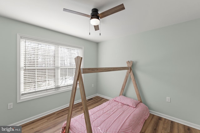 bedroom with hardwood / wood-style flooring and ceiling fan