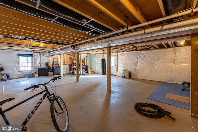 basement with washer / clothes dryer and water heater