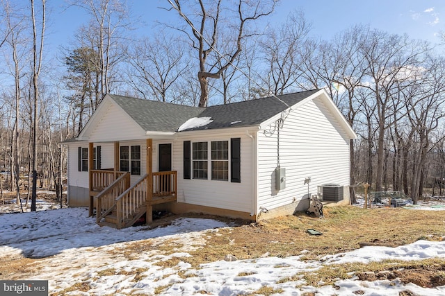 view of front of house featuring cooling unit